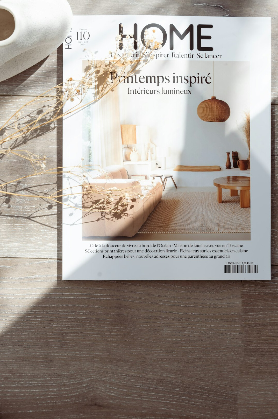 Magazine layout spread on a design desk